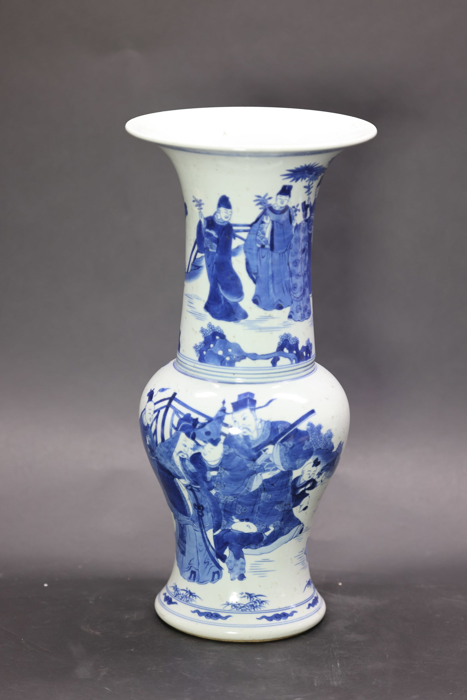 A 'Kangxi'-Style Blue and White 'Figures' Phoenix-Tail Vase, Late Qing Dynasty: Estimated Date: Late Qing to Republic Period. A Kangxi-style blue and white porcelain fengweizun (phoenix-tail vase) bearing an apocryphal "Made during the Kangxi Reign of the Great Qing" mark.Attribu