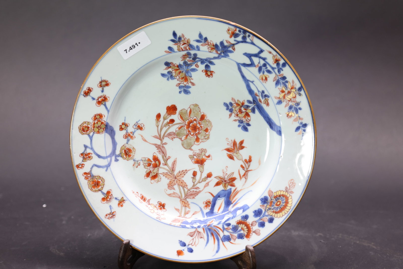 A 'Famille-Verte' and Gilt 'Flowers of the Four Seasons' Dish, Qing Dynasty, Kangxi Period: Estimated Date: Kangxi Period, Qing Dynasty. A blue and white, iron-red and gilt export porcelain dish made for the European market.Attribution: The dish is of gently everted form with a broad rim, de