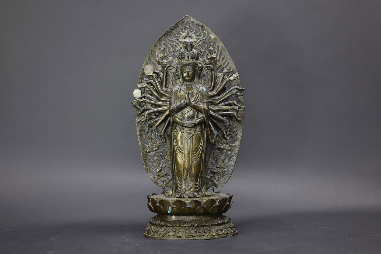A Partly Gilt-Bronze Figure of a Thousand-Armed Avalokiteshvara, Qing Dynasty: Estimated Date: Mid to Late Qing Dynasty. A Sino-Tibetan bronze figure of the Eleven-Headed, Thousand-Armed Avalokite?vara (Sahasrabhuja Avalokite?vara) with partial gilding.Attribution: The sculpture