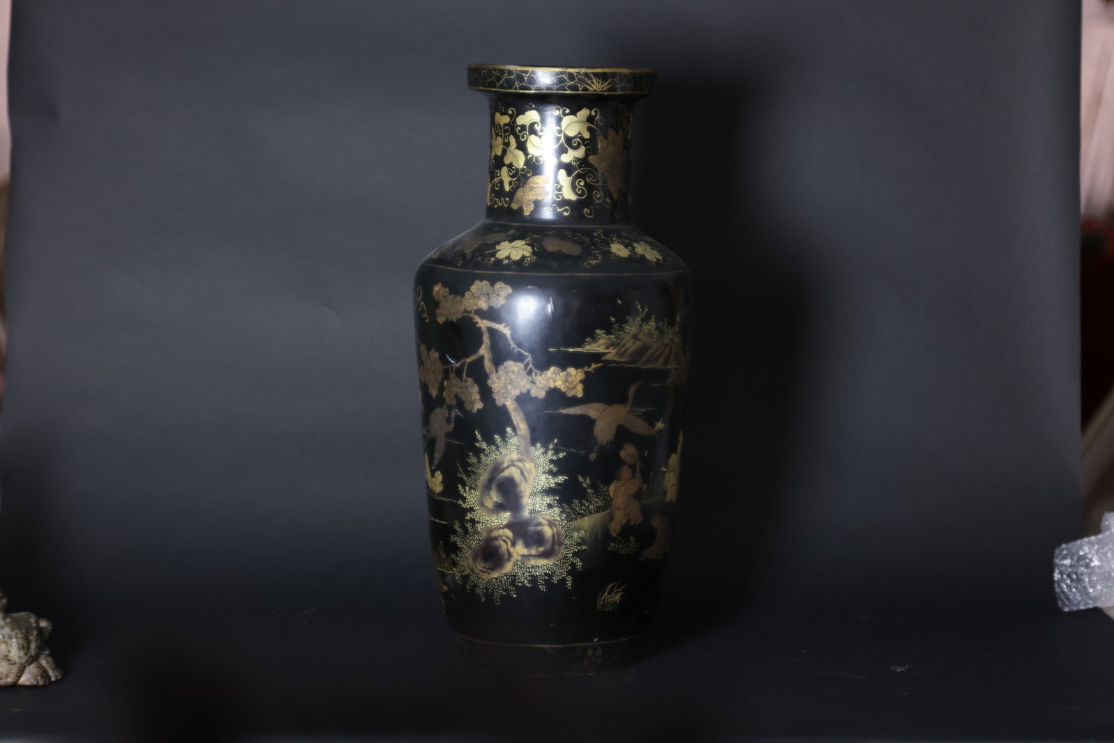 A Rare Large Gold-Lacquer 'Landscape and Boys' Rouleau Vase, Qing Dynasty: Estimated Date: Late Qing Dynasty. A Fuzhou black lacquer and gilt-decorated display vase.Attribution: The vase is constructed with a wooden core finished in black lacquer, richly decorated overall in