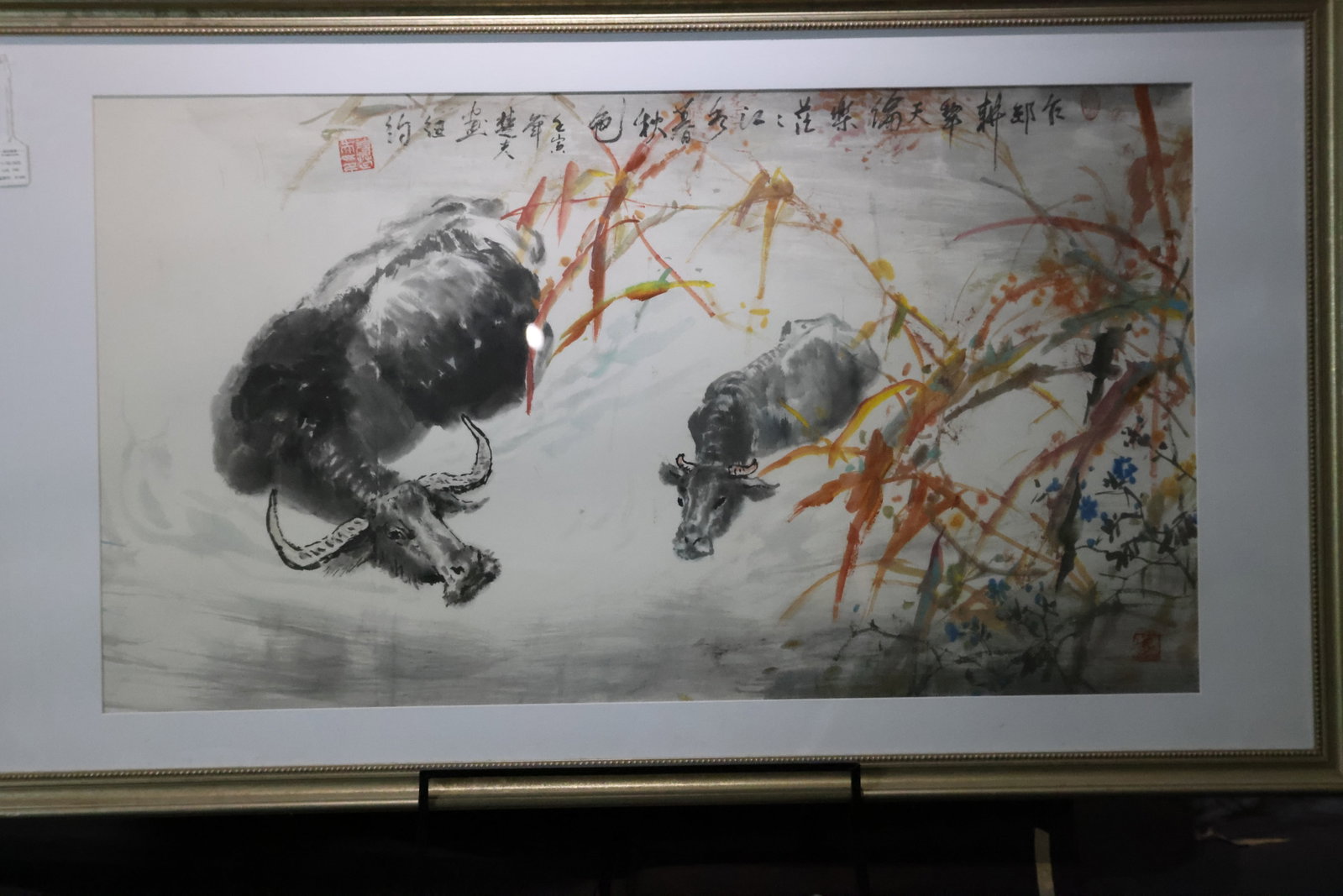 A 'Water Buffaloes by an Autumn Stream' Ink and Color Paper Scroll, Contemporary School: Estimated Date: Modern Period, dated to a Renyin year. A freehand ink-and-color painting of water buffaloes in a rural landscape, executed on paper.Attribution: Executed in ink and color on paper,