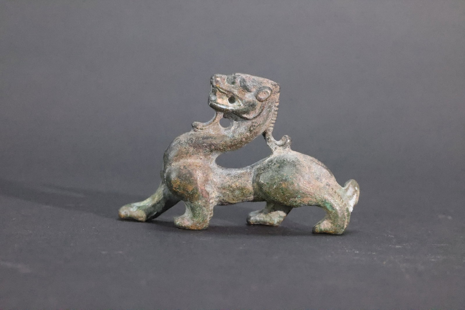An Archaistic Bronze Figure of a 'Chilong', Small Size: Dimensions:Height: 6.5 cm (2.6 in.)Width: 9.5 cm (3.7 in.)
