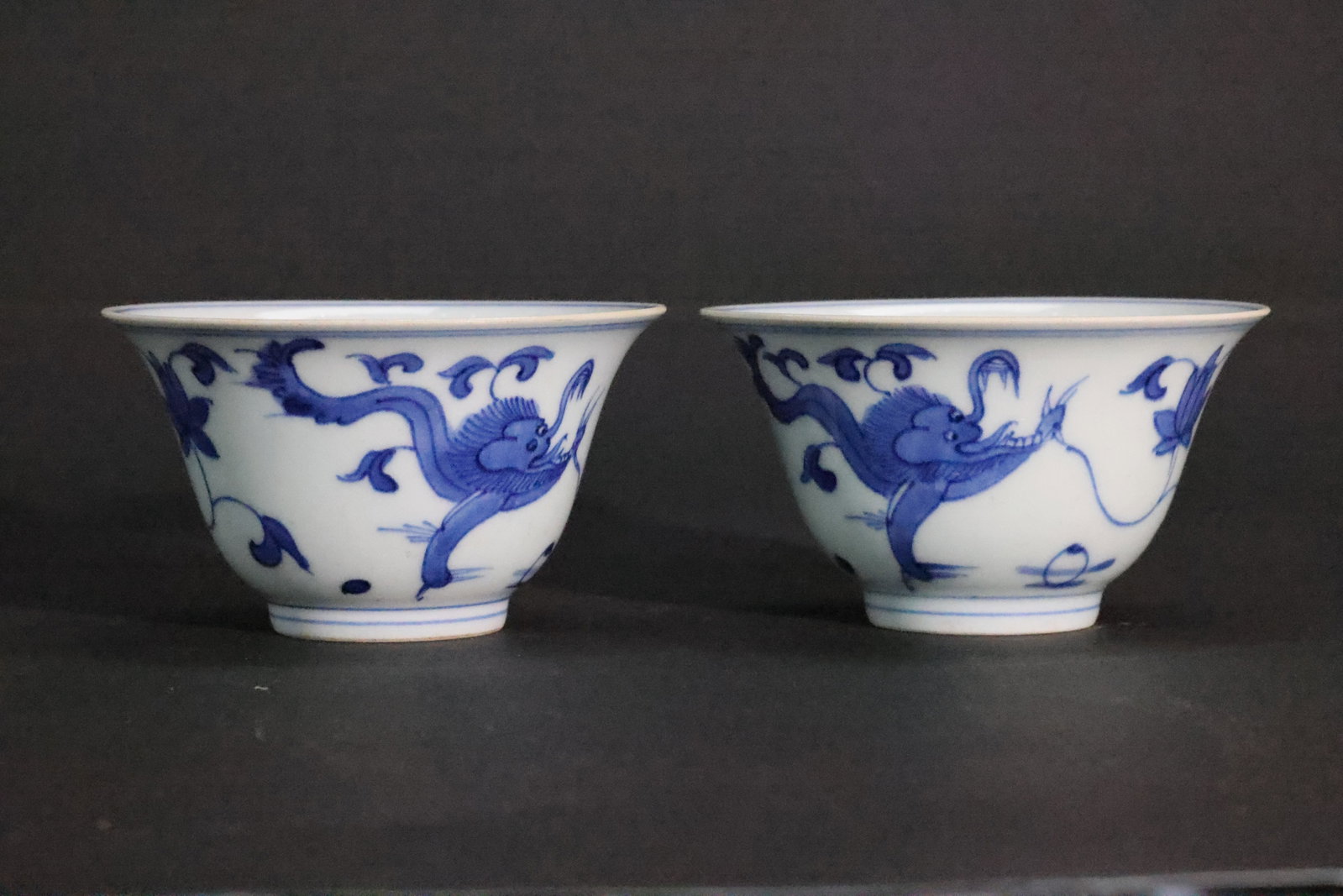 A Pair of Blue and White 'Chilong and Floral' Flare-Mouthed Cups, Late Qing Dynasty, 'Dingwei' Mark (1 of 5)