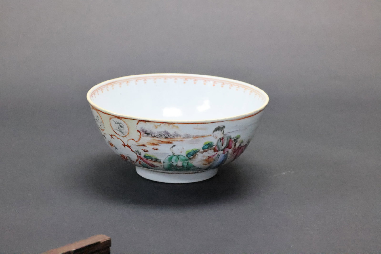 A Large Canton Famille Rose 'Courtly Narrative Figure' Windowed Bowl, Late Qing Dynasty: Estimated Date: Late Qing Dynasty, Daoguang to Tongzhi period (1821–1874). An export famille rose Canton enamel porcelain bowl.Attribution: This large porcelain bowl was produced for the export mark