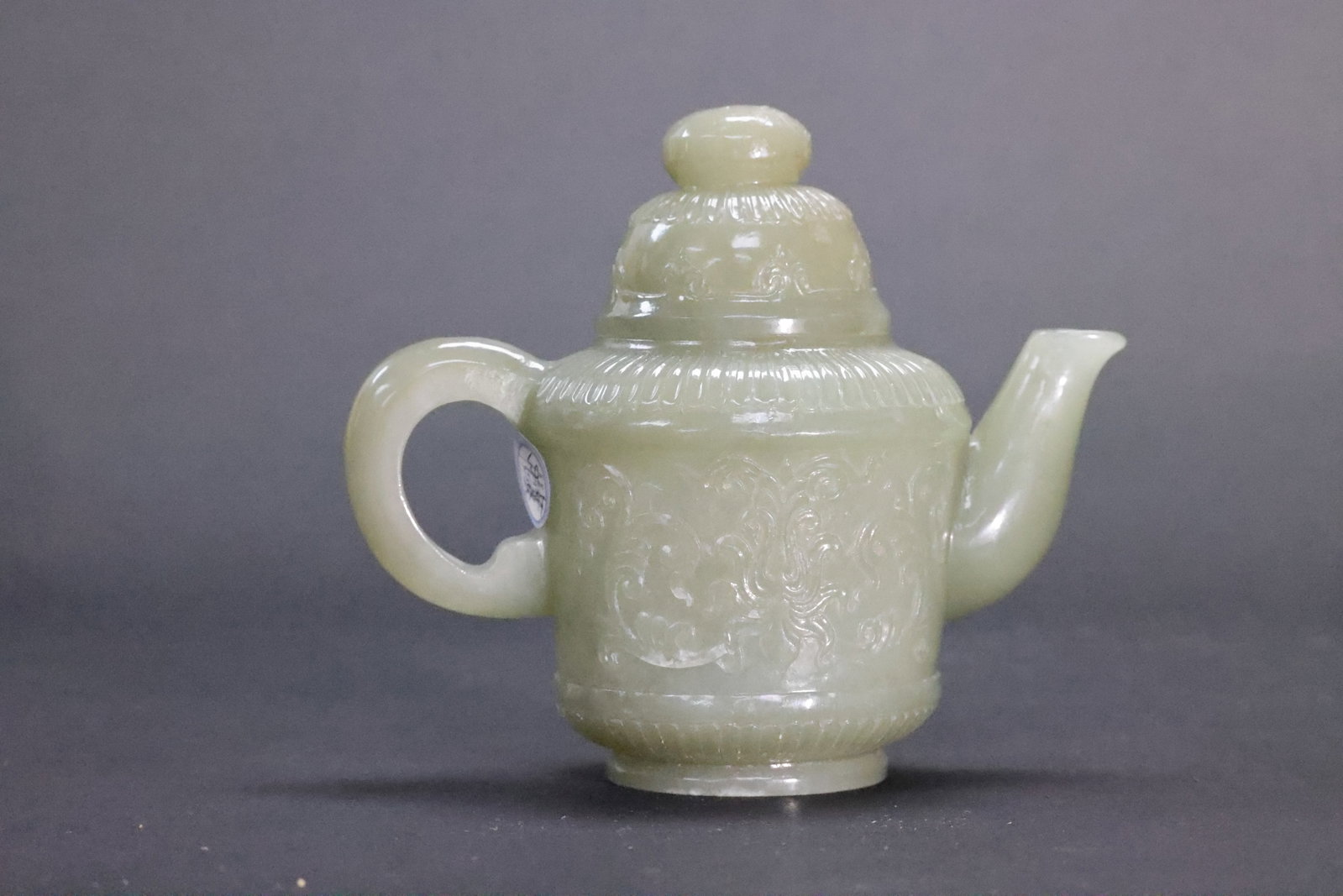 A Qing Dynasty Celadon and White Jade 'Floral Scrolls' Ewer, Qing Dynasty (1 of 7)