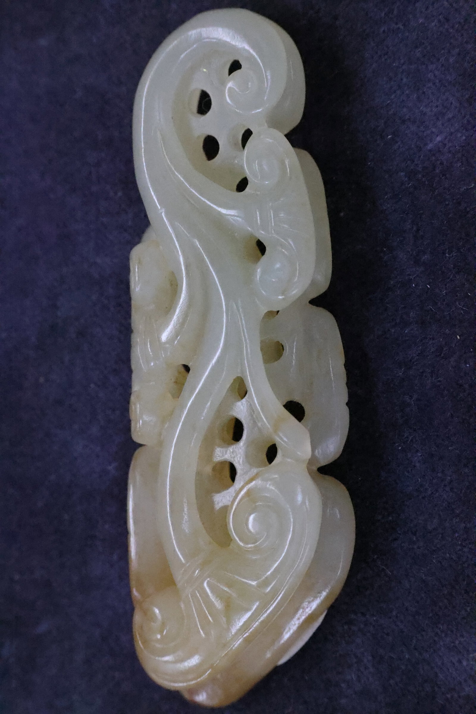 A Celadon and White Jade 'Chilong and Cloud Scrolls' Pierced Belt Hook (1 of 5)