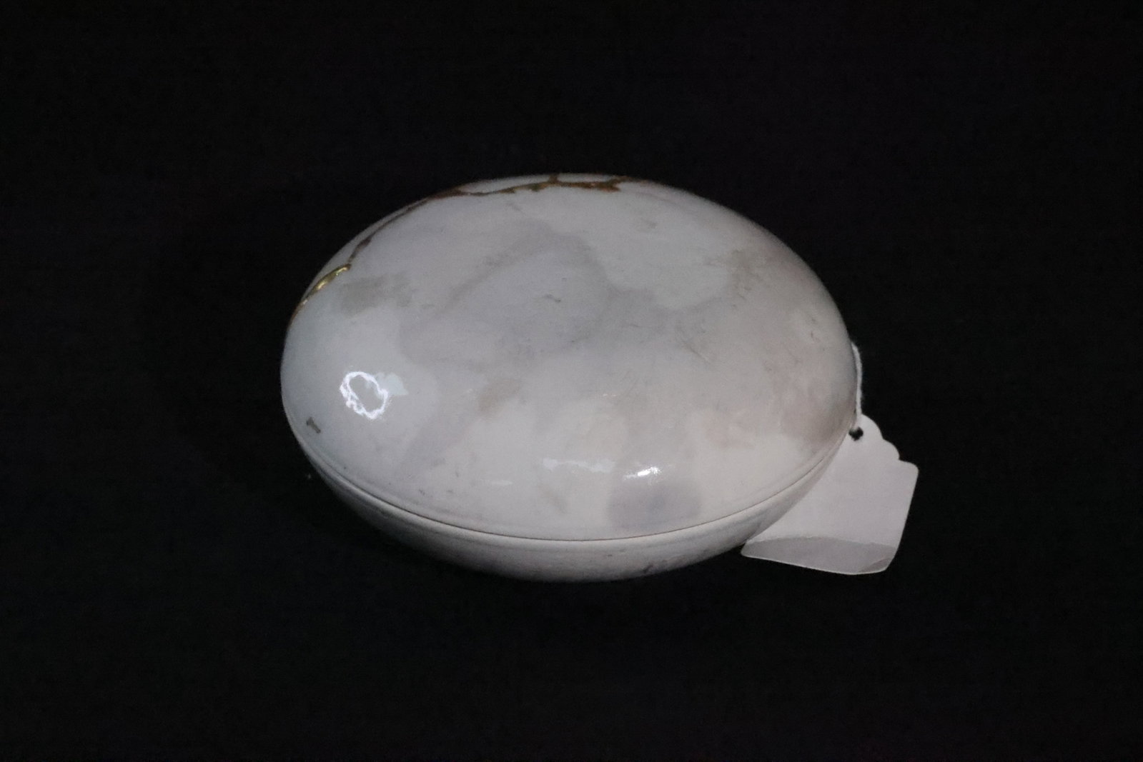 A White-Glazed 'Floral' Incised Paste Box, Late Qing Dynasty: Estimated Date: Late Qing to Republican period (late 19th–early 20th century). A white porcelain scholar's seal paste box with incised peony decoration.Attribution: This circular white porcelain sea