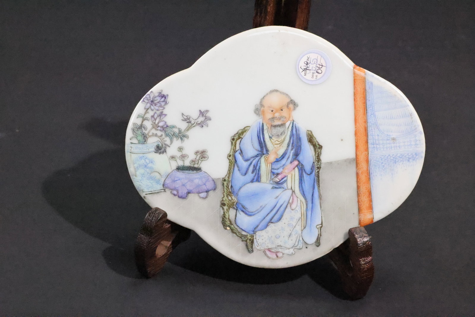 A 'New Famille Rose' 'Bodhidharma' Begonia-Shaped Porcelain Plaque, Republic Period: Estimated Date: Middle to Late Republican Period (early–mid 20th century). A famille rose lobed porcelain plaque depicting Bodhidharma in a scholar's setting.Attribution: This begonia-shaped (haitan