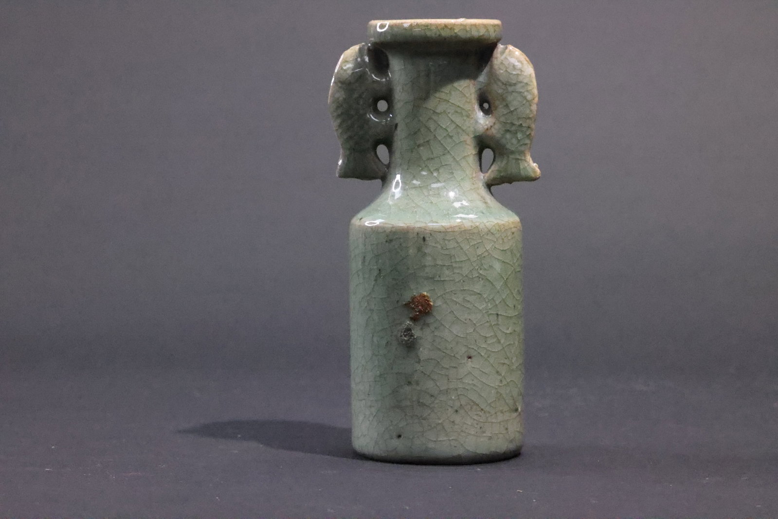 A Longquan Celadon 'Twin-Fish' Bottle Vase, Ming Dynasty: Estimated Date: Mid- to Late Ming Dynasty. A Longquan celadon double-fish handled scholar's vase.Attribution: This Longquan celadon vase is attributed to the mid- to late Ming Dynasty and was likely p