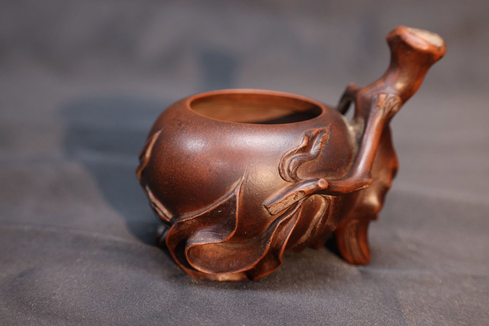 Late Qing–Republic Period Yixing Peach-Form Scholar's Water Dropper: Estimated Date: Late Qing Dynasty to the Republic Period. A Yixing peach-form scholar's water dropper.Attribution: This finely modeled Yixing scholar's water dropper is fashioned in the form of a ripe