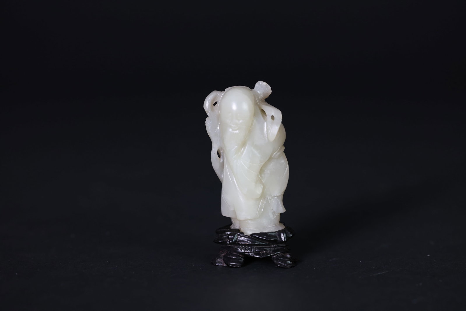 Qing Dynasty Sugar-White Jade Carved Figure of Shou Xing, God of Longevity: Naturally aged patina, otherwise in excellent overall condition. H 6.5cm W 3.5cm