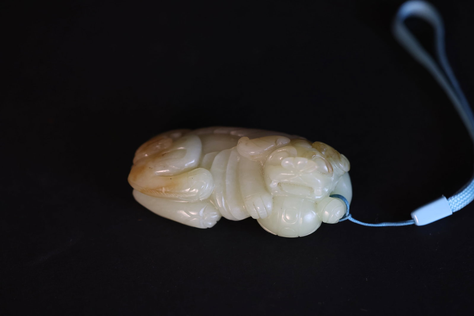Pure White Jade Handheld Carving: Lion Playing with a Ball: Natural patina, otherwise in excellent condition H 3.2cm W 7.5cm