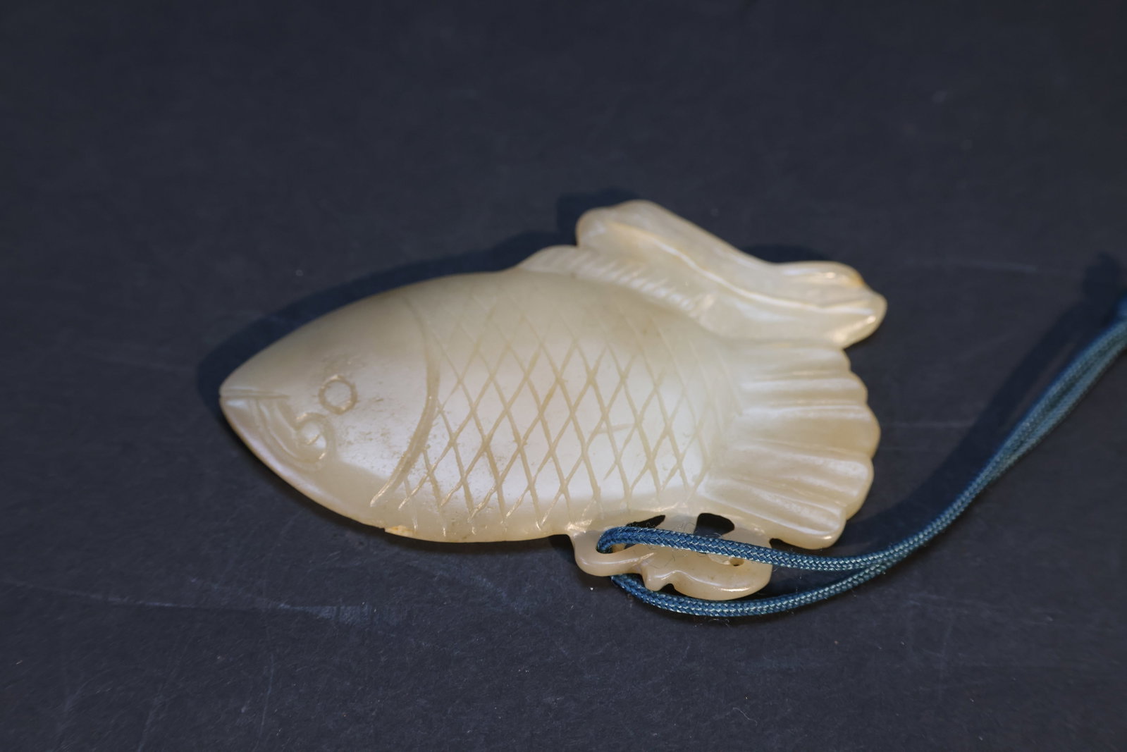 Qing Dynasty White Jade Carved Fish Pendant: Natural patina, age wear, otherwise in excellent overall condition. H 5.4cm W 7.9cm