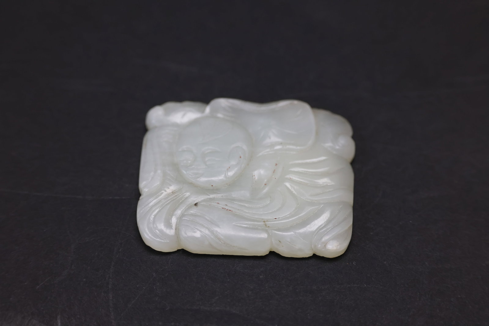Qing Dynasty Small Jade Plaque Depicting Boy Holding Lotus (1 of 3)