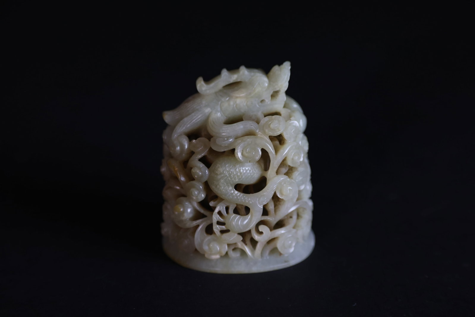 Yuan–Ming Hetian Pale-White Jade Censer Cover with Cloud-and-Dragon Motif: Naturally aged with original patina; otherwise in excellent overall condition. H 6.8cm W 5.5cm
