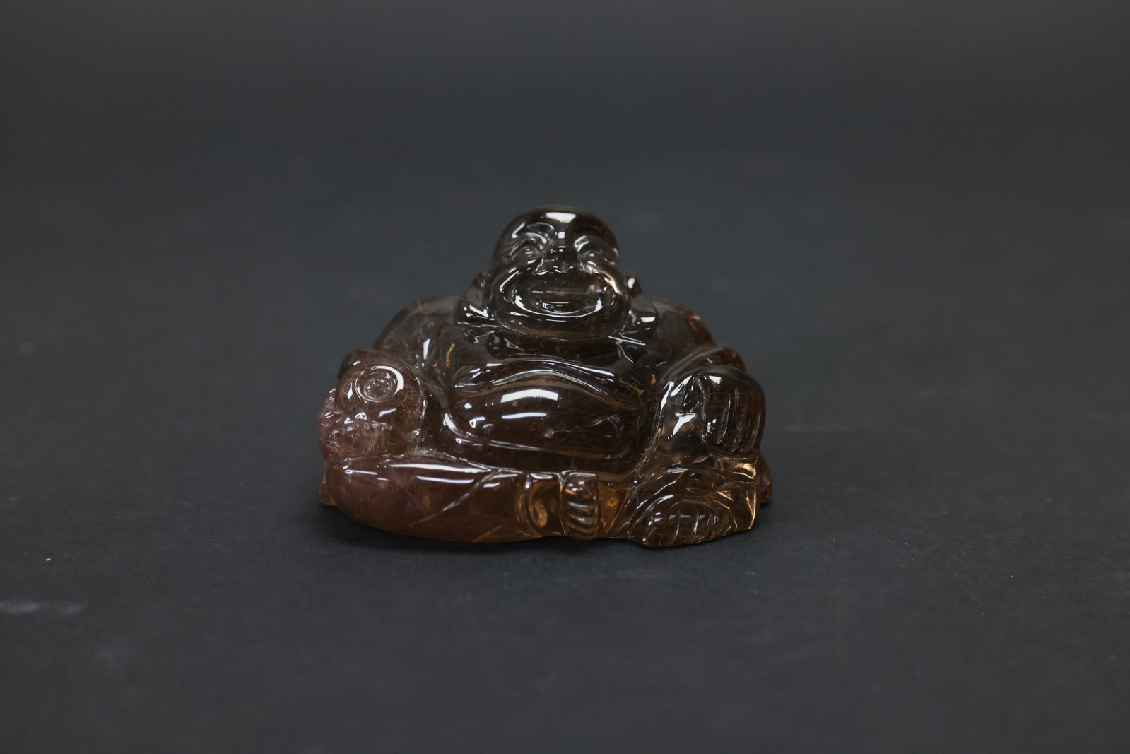 Republic Period Gilt and Smoky Quartz Seated Smiling Maitreya Buddha: H 4.3cm. W 7.1cm