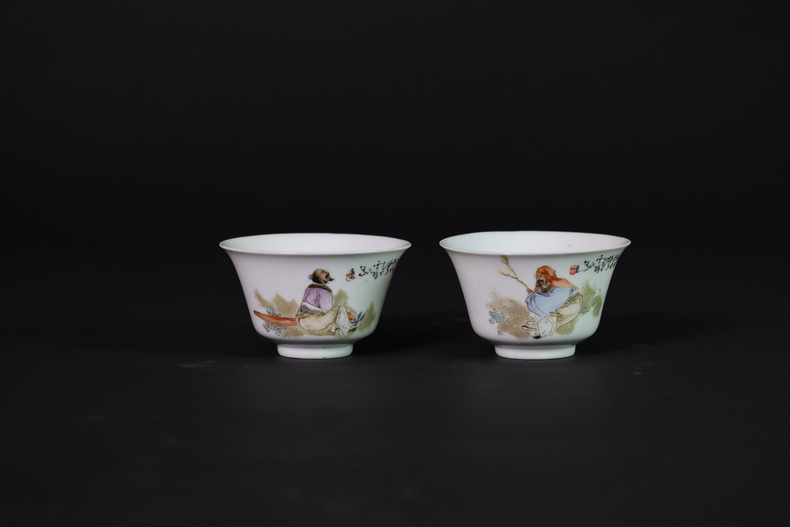 1950-70s Pair of Qianjiangcai teacups with figural scenes, poetic inscriptions and painted seals: H 6.5cm W 10.8cm
