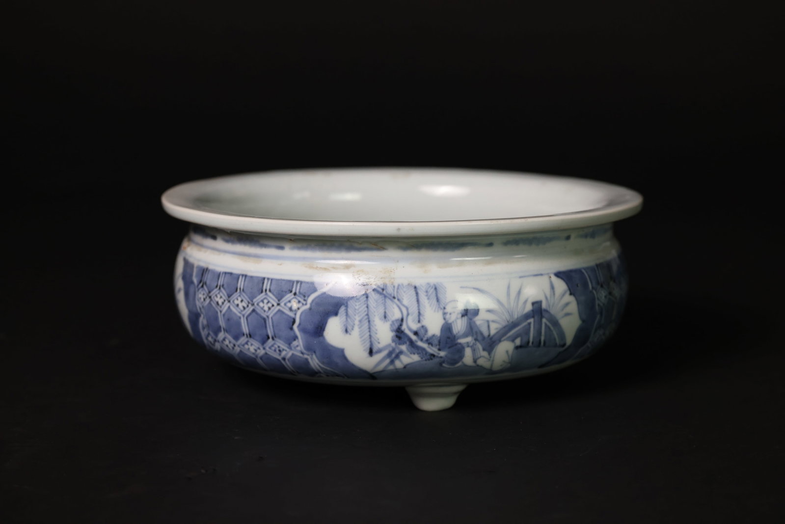 Ming Dynasty Blue-and-White Porcelain Tripod Censer with Scholar and Floral Cartouches: Naturally aged patina, kiln marks in four areas, otherwise in excellent condition. H 10.9cm. W 26.8cm