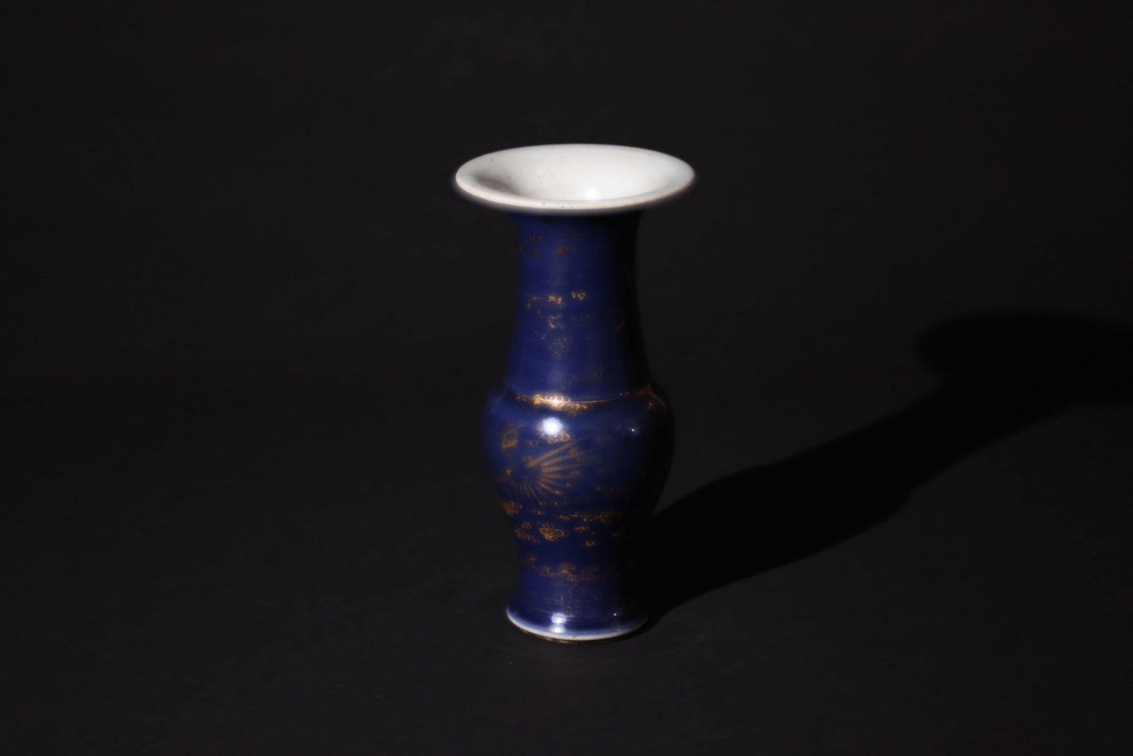 Early Qing blue?glazed Guanyin bottle with gilt dragon and phoenix: Natural age wear, loss of gilt and enamels, patina, signs of use; a 10cm firing line and "chicken claw" marks inside the bottle; otherwise in overall good condition. H 24cm W 12cm