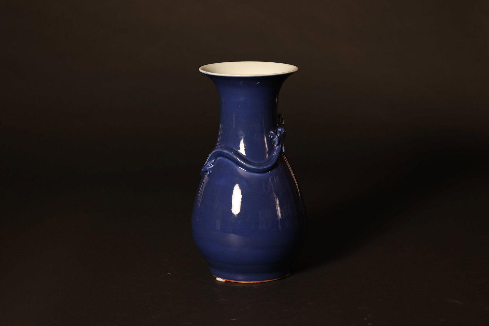 Late Qing Dynasty blue?glazed vase with applied?relief dragon decoration: Naturally aged with signs of use; one repair to the rim measuring 0.8 x 0.3 cm, otherwise in overall good condition. H 28cm W 12.2cm