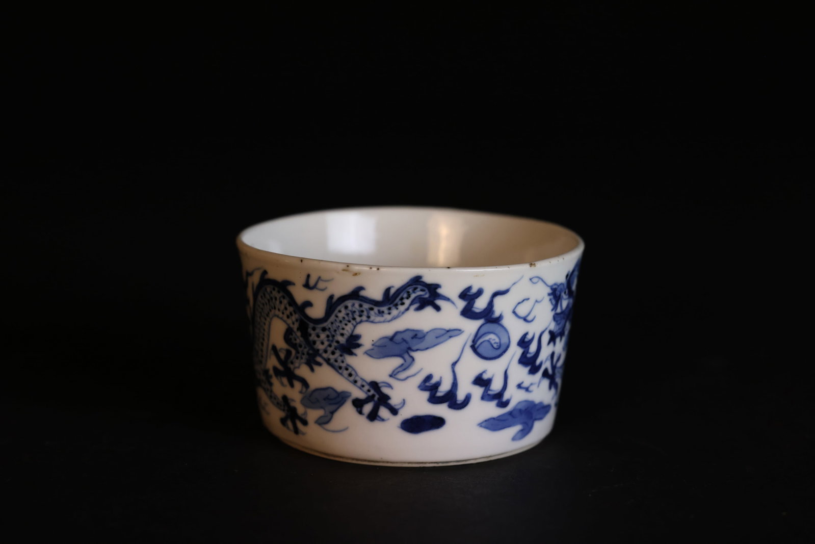 Late Qing Blue-and-White Small Water Basin, 'Ruoshen Zhencang' Inscription, Pearl?Chasing Dragon: Naturally aged patina, with a sesame-sized chip; otherwise in excellent condition. H 5cm W 8.6cm