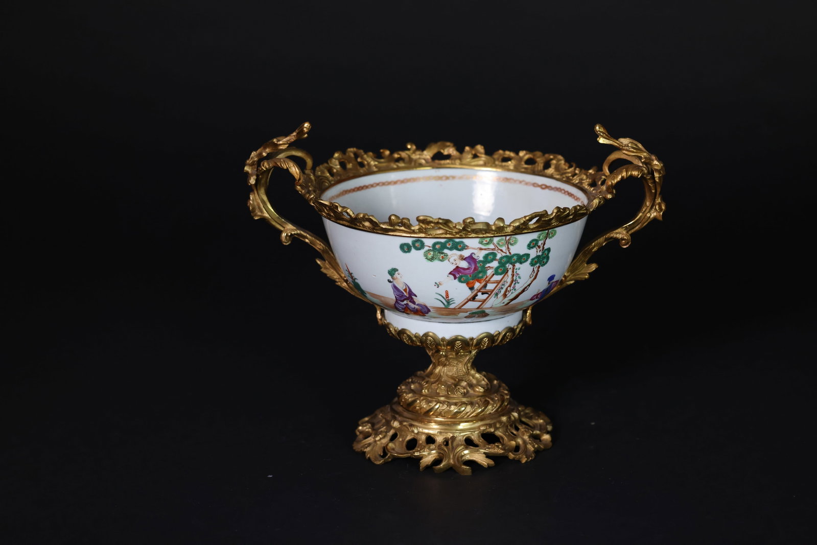 Mid?Qing Famille Rose Bowl with Western Figures and Bronze Mounts: Naturally aged, with signs of wear and surface rubbing, and areas of color loss. H 26cm x W 31cm