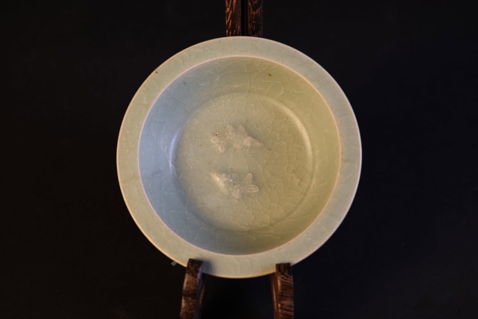 Ming Dynasty Longquan Kiln Celadon "Double-Fish" Small Dish: Naturally aged with one firing line (2.5cm) at the rim and a professional restoration (0.5 x 1.2cm) at the mouth; otherwise in excellent condition. H 4cm W 13.6cm