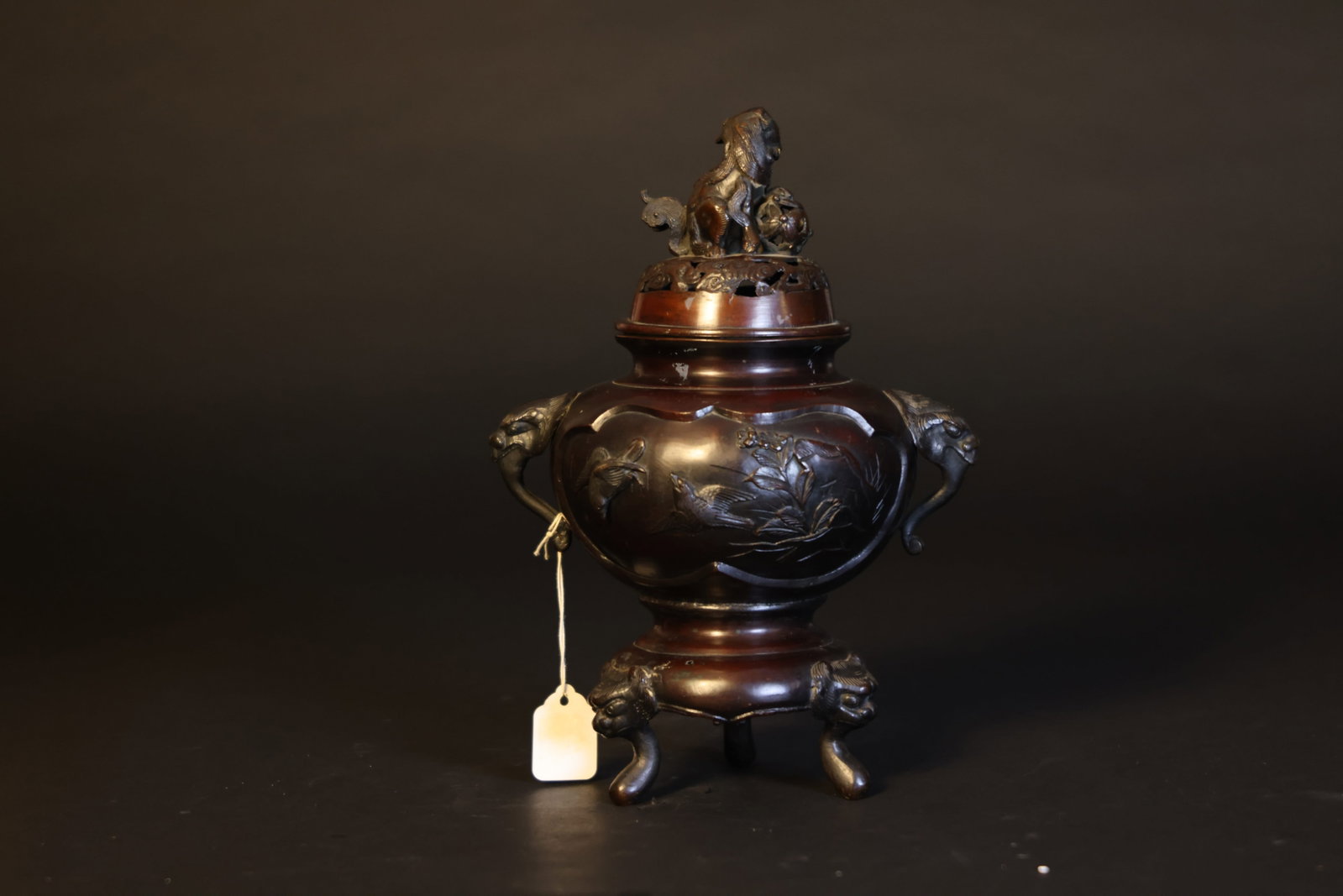 Republic of China Bronze Relief Floral-and-Bird Censer with Double Beast-Head Handles, Lion Finial: Natural age wear and patina; otherwise in excellent overall condition. H 34cm W 23cm