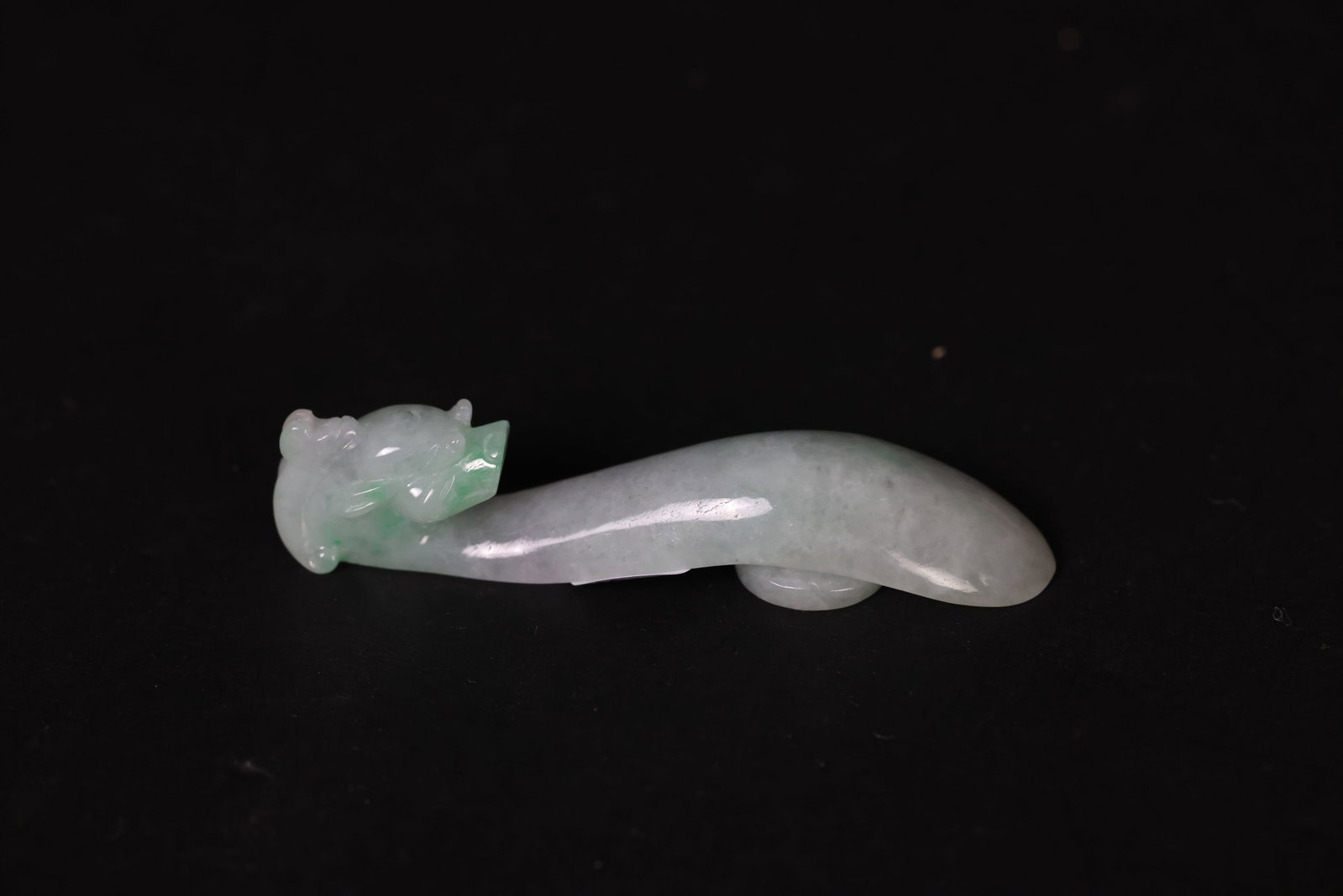 Carved Chinese Jadeite Belt Hook: Natural age patina, otherwise in excellent condition H 2cm W 8.5cm