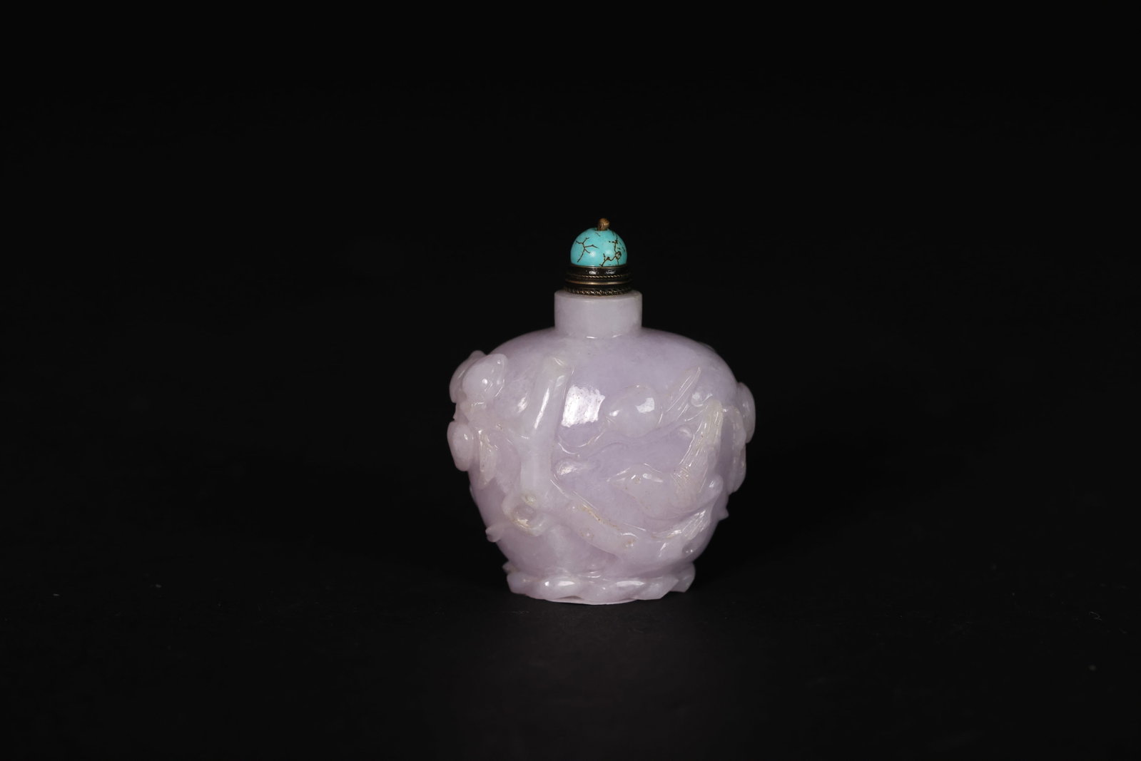 Purple Jadeite Snuff Bottle Carved with Magpies and Longevity Peaches, Turquoise Stopper: Naturally aged patina, otherwise in excellent overall condition. H 6cm W 5cm