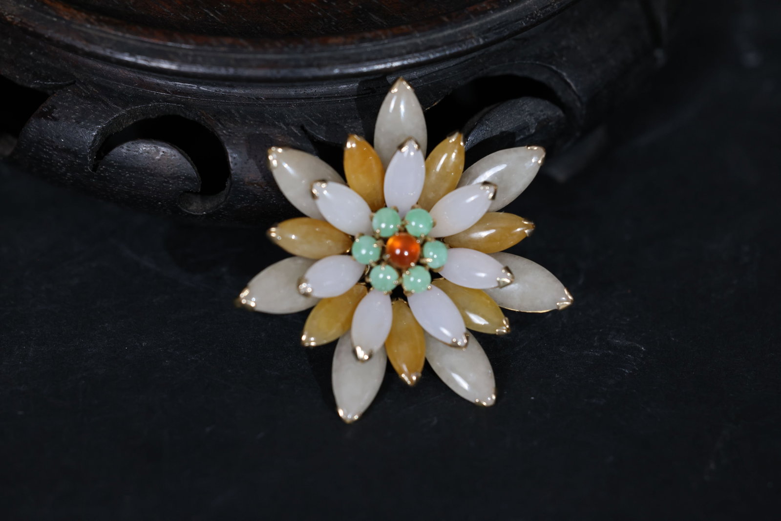Tricolor Jadeite Flower-Form Brooch: Jade is intact with no chips or cracks; setting is secure; minor localized wear to the gold plating; opal shows no significant abrasions; pin mechanism is in good working order. Weight: 19g