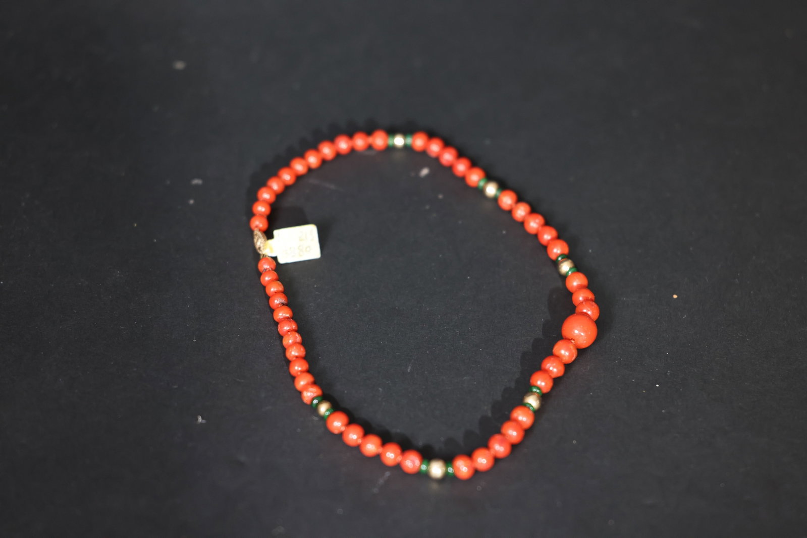 Vintage Coral Bead Necklace with Jadeite Spacers and Gold Beads: Jade is intact with no chips or cracks; setting is secure; minor localized wear to the gold plating; opal shows no significant abrasions; pin mechanism is in good working order. Weight 21g