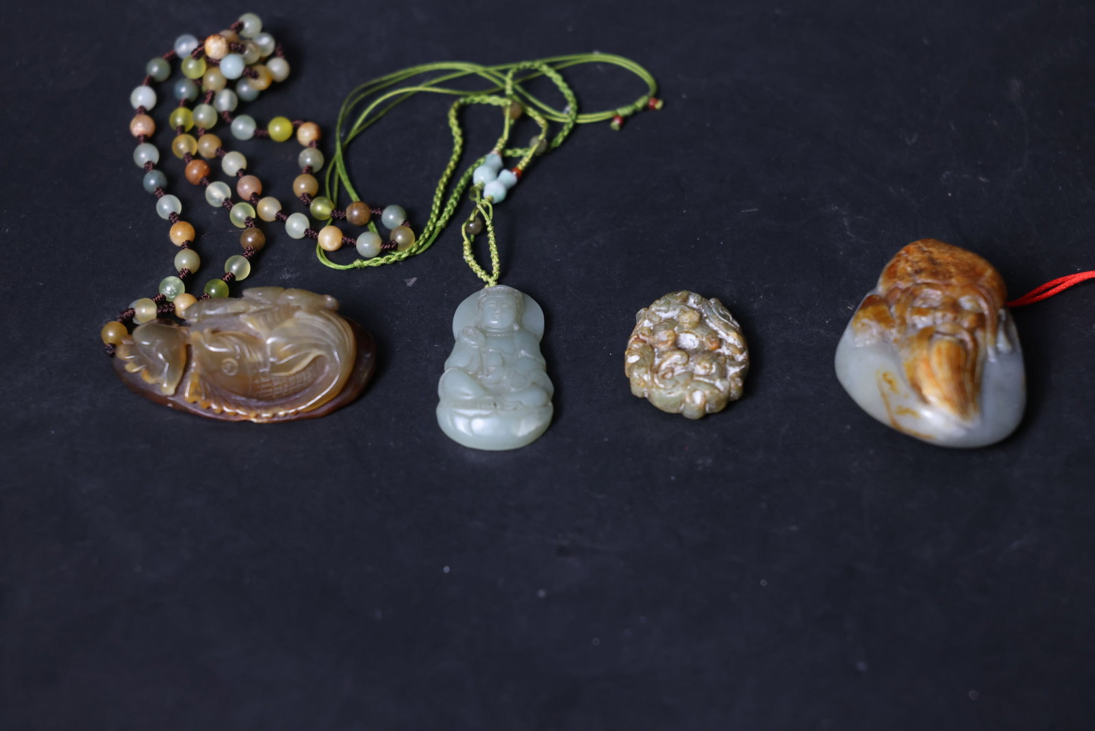 Group of Antique Jade Pieces: Overall intact. The agate piece has an old weathered layer on the back; the Guanyin figure shows minor age-related fissures; the chilong pendant displays a rich patina with edge wear consistent with a