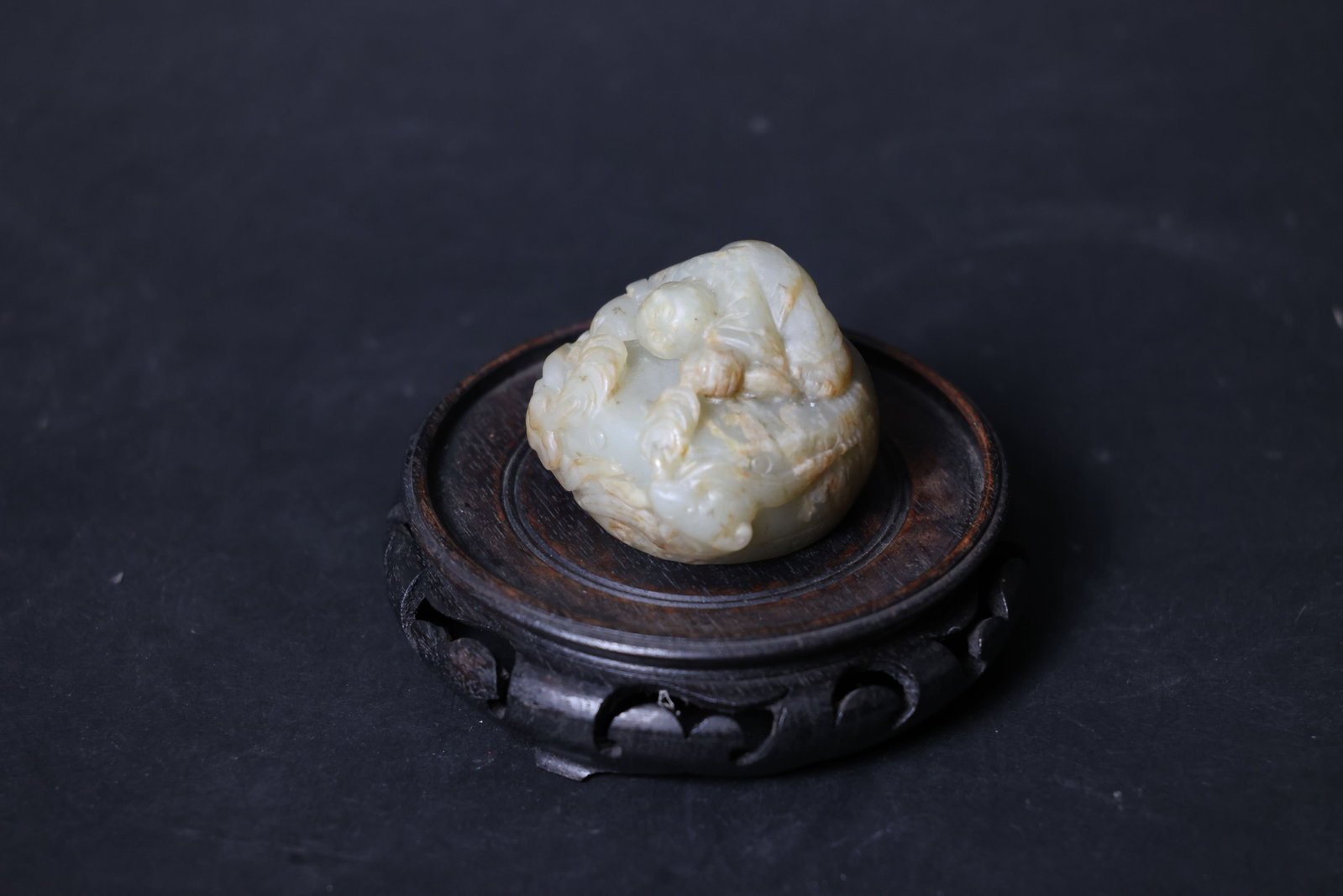 Ming Dynasty Hetian Qingbai Jade Paperweight Boy Beating Drum: Overall intact. The jade material displays natural fissures and calcification, with areas of old patina. Minor wear to the edges and corners consistent with age, no significant chips or cracks. H