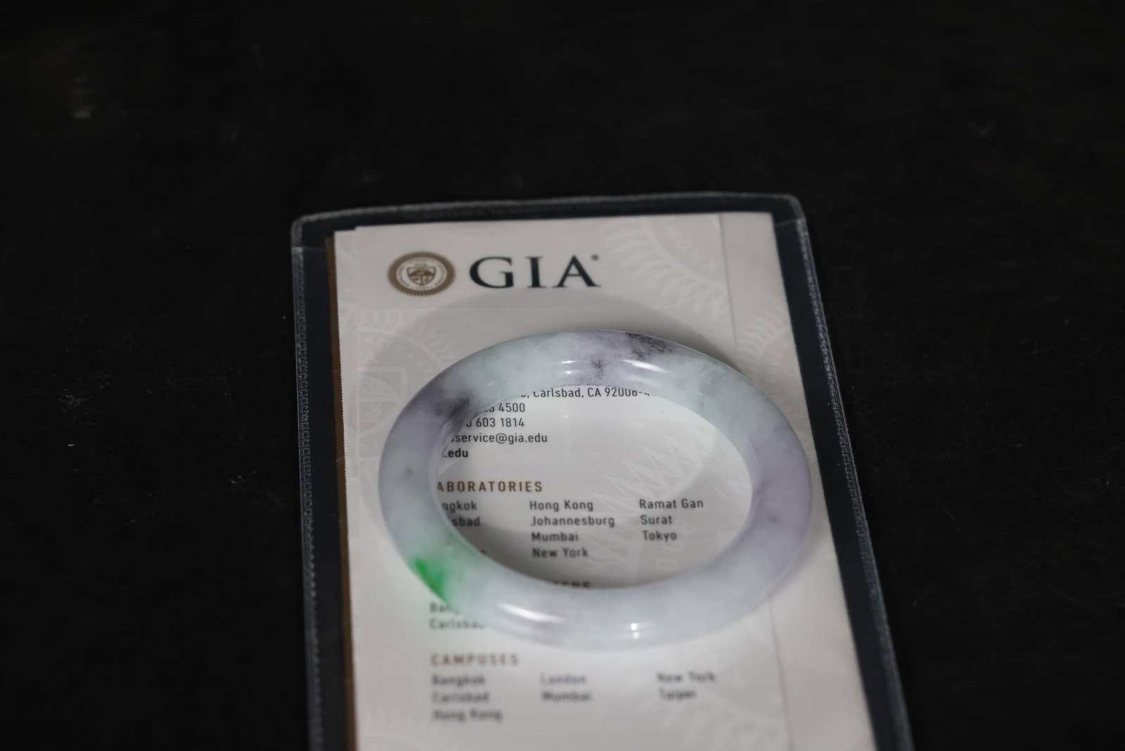 Jadeite Round Bangle (Spring-Colored) with GIA Certificate: The jade section is intact, with gold mountings showing age-related wear. The clasp opens and closes smoothly, with no missing parts. Weight: 382.05 carats; Measurement: 81.70 x 11.49mm; Shape: Bangle
