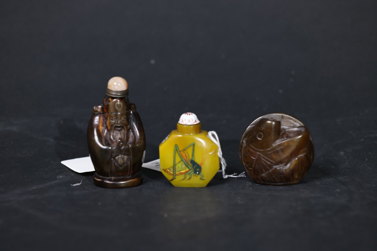 Set of Chinese Snuff Bottles: Overall intact with no cracks or chips; patina on the metal mounts is rich, with expected wear to edges from age and use; minor enamel loss to the glass in places; natural coloration and age-related