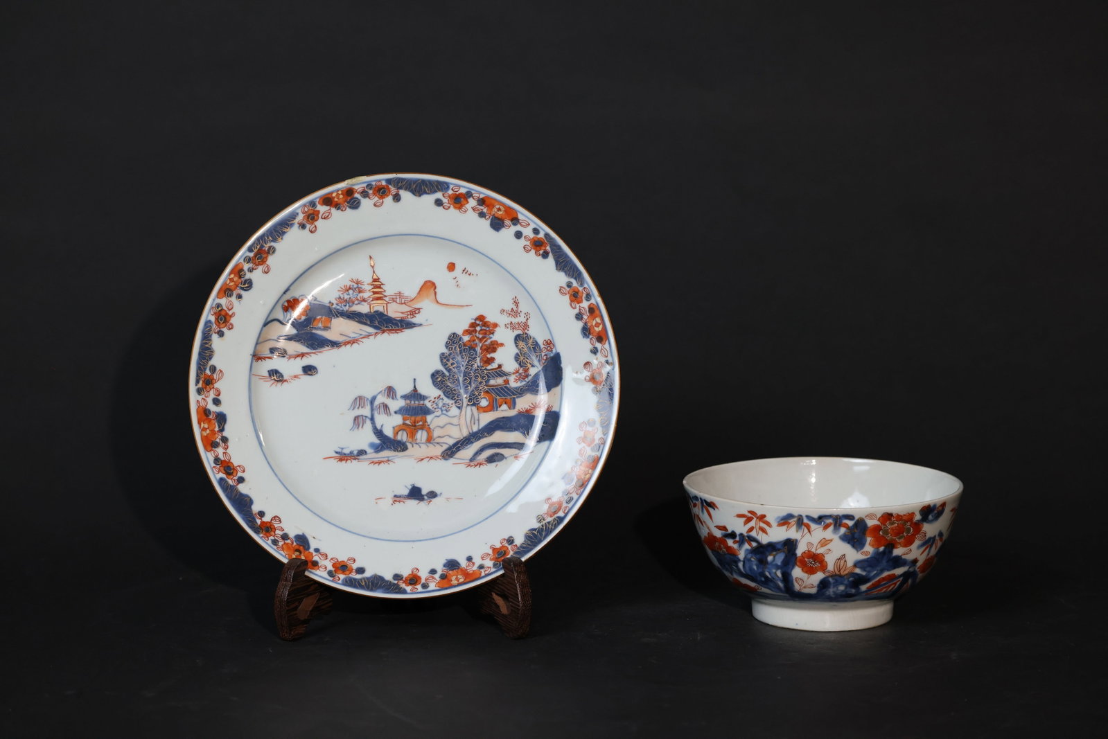 Kangxi blue-and-white with overglaze red and gilt, landscape with pavilions, dish & bowl: Minor nick to the rim, some gilt wear, surface wear consistent with age and use, no cracks; bowl is intact with slight enamel loss. H 2.5cm W 22.5cm