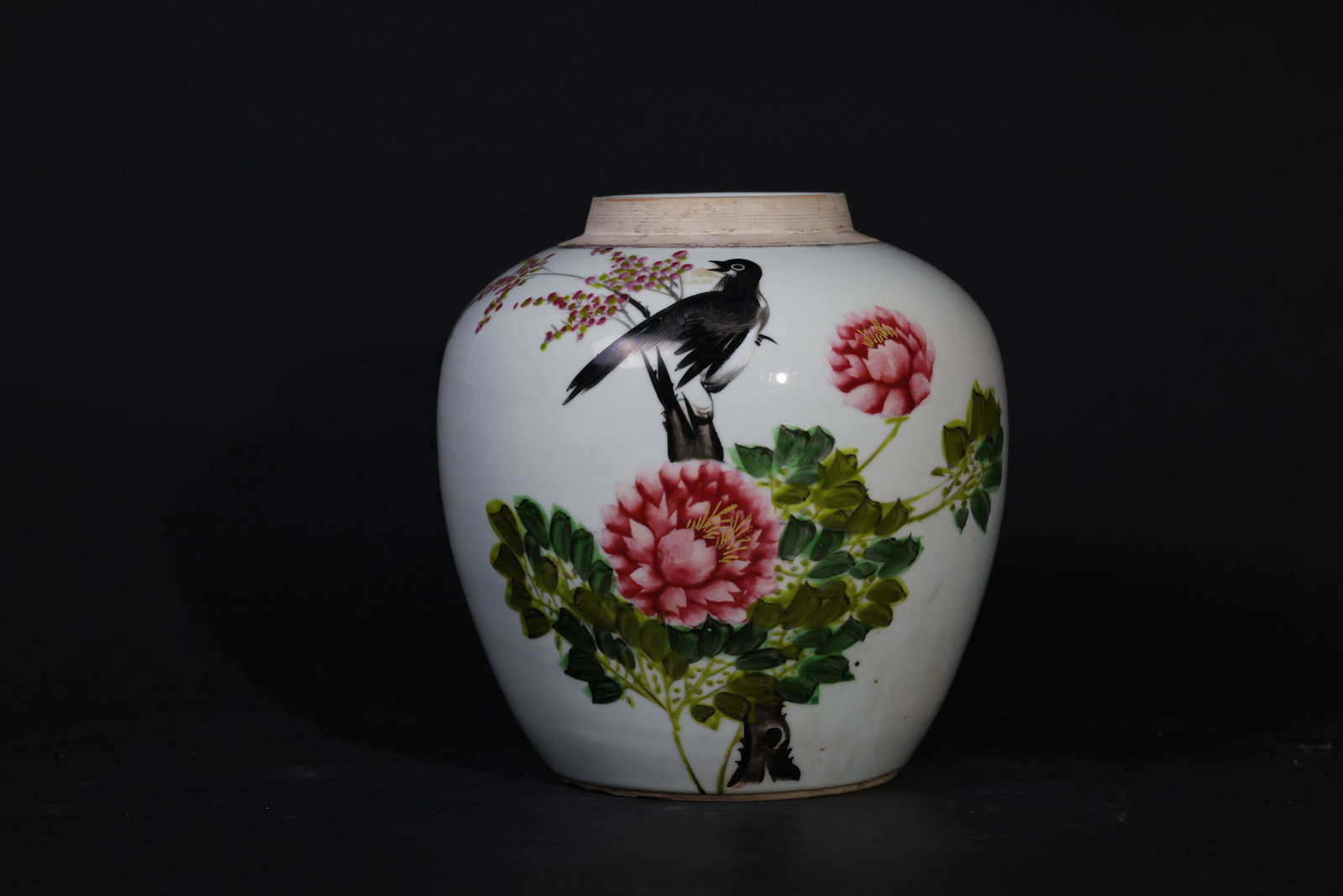 Large Famille Rose Jar with Flowers and Birds: The body is intact with some old wear and minor chips to the foot; glaze shows natural age; no hairlines; missing cover. H 22cm W 19cm