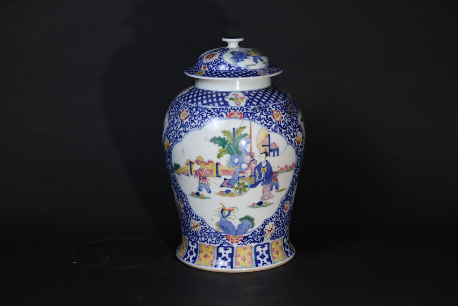 Late Qing blue-and-white and famille-rose "General" jar with figural medallions: The vessel is generally well-preserved, with minor restoration and traces of repair to the rim. Some areas of the enamel are worn, and there are remnants of old ink on the body. The base shows natural