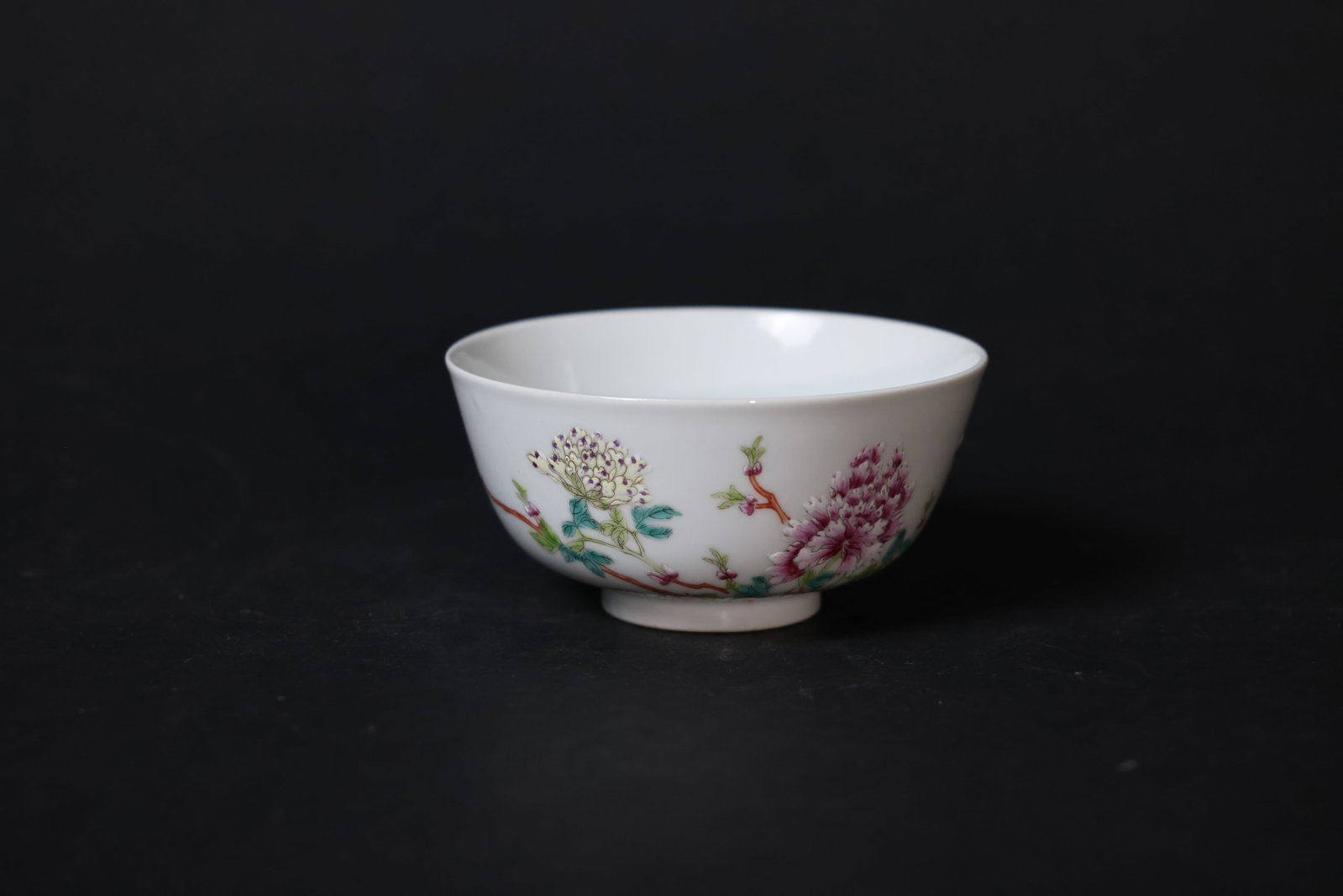 Famille Rose Porcelain Flower-and-Bird Bowl, Guangxu Period (Qing Dynasty): In excellent condition with no cracks, chips, or repairs to the rim or body; enamels are well preserved. The foot shows minor wear consistent with age and use. H 5.5cm W 11.5cm