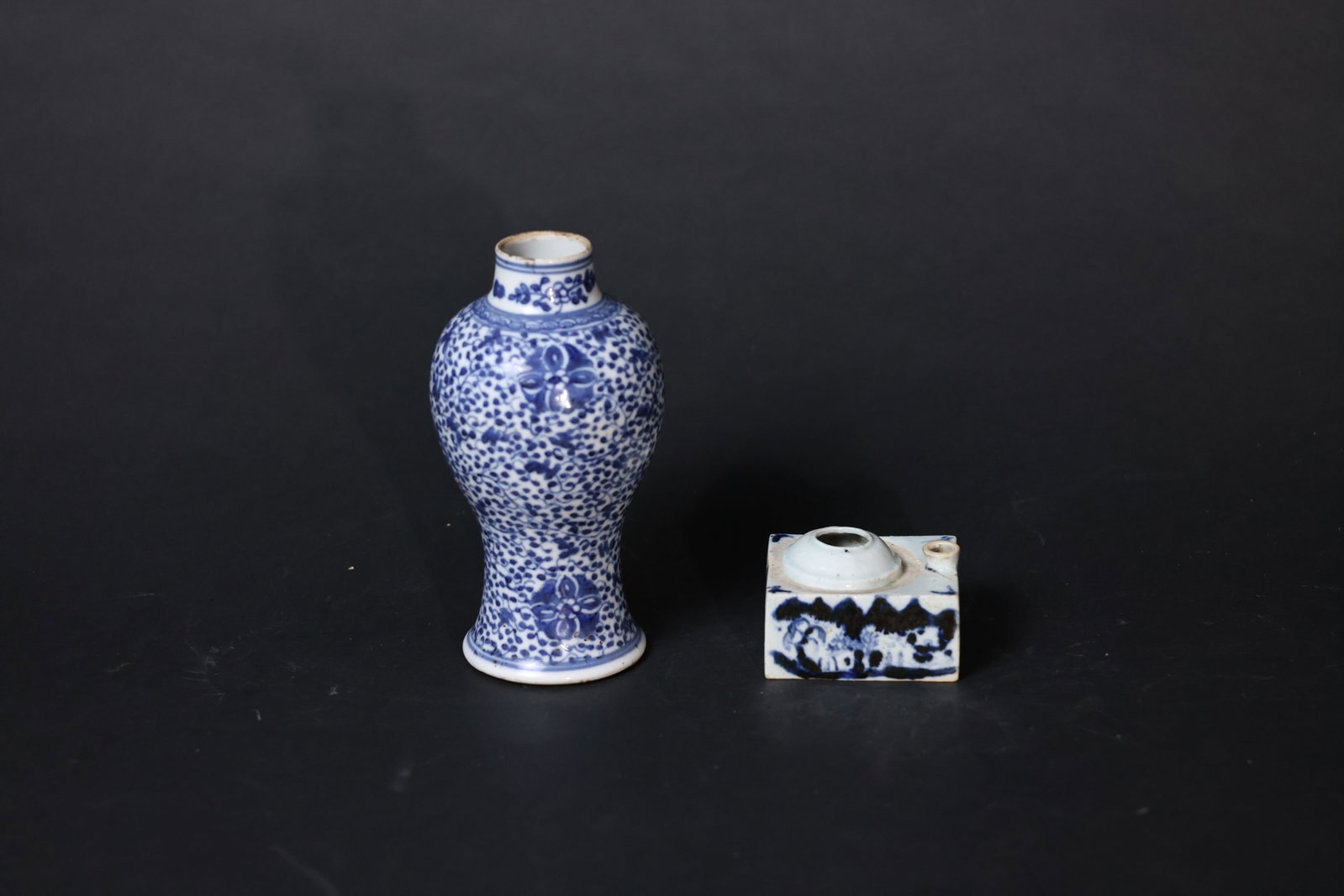 Mid-Qing Blue-and-White Floral Meiping and Square Landscape-Figural Scholar's Water Dropper: The meiping vase has minor nicks to the rim, an old hairline to the body, and expected wear to the foot consistent with age. The scholar’s water dropper shows several old hairlines to the body and a