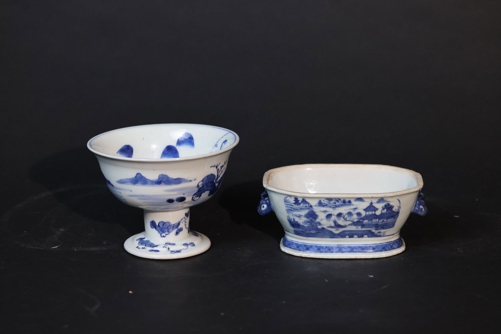 Mid-Qing blue & white landscape bowl; Mid-Qing blue & white basin, beast-ear handles: The foot rim of the blue and white landscape stem bowl has minor nicks; the bowl body is intact with no cracks, showing traces of use consistent with age. The blue and white square washer with beast-h