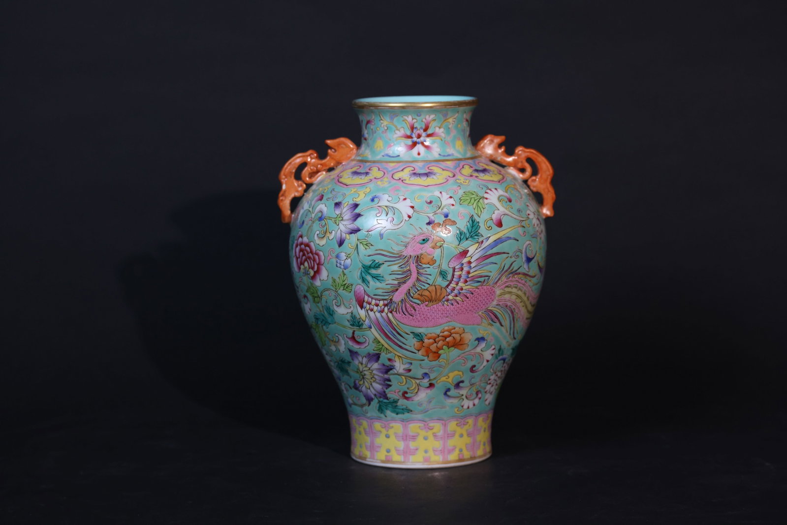 Qing Jiaqing Turquoise-Ground Famille Rose Dragon and Phoenix Double-Handled Zun: Overall in good condition with minor wear to the gilt rim, both handles intact, slight surface wear to the enamels consistent with age, no cracks or chips, and natural wear to the foot commensurate wi