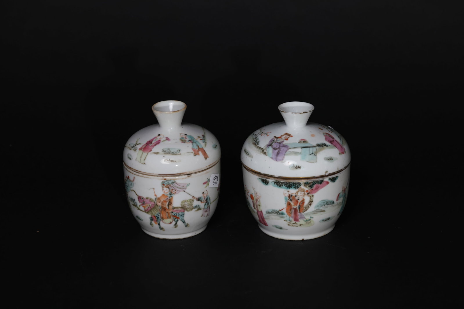Qing Dynasty (Tongzhi) Famille Rose Covered Jar with Figural Story Scene: Overall intact. The rim and foot show natural wear consistent with age; partial gilt loss to the rim. The cover is original to the jar, with no cracks. Minor glaze flakes and obvious signs of use thro