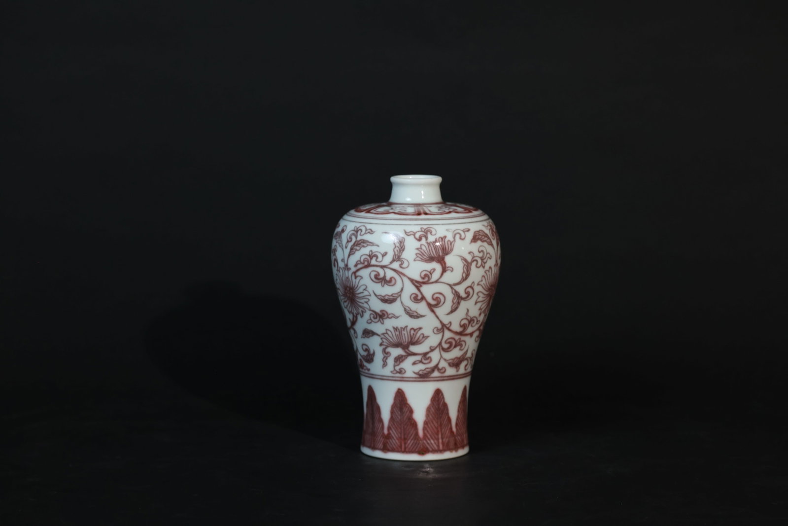 Qing Dynasty Underglaze-Red Meiping Vase, Intertwined Lotus Scrolls: The piece is intact, with normal diffusion and minor green specks in the underglaze red (a natural result of copper-red firing). No cracks or chips. Minor wear to the rim and foot consistent with age.