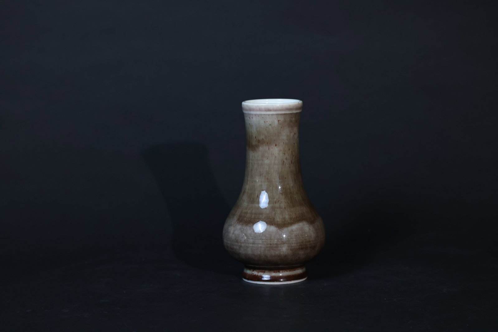 Late Qing Dynasty Flambé-Glazed Pipa-Form Vase: The piece is free from cracks or chips. The two white reflections on the body are from photography lighting, not damage. The rim and foot show minor wear consistent with age. The glaze exhibits natura