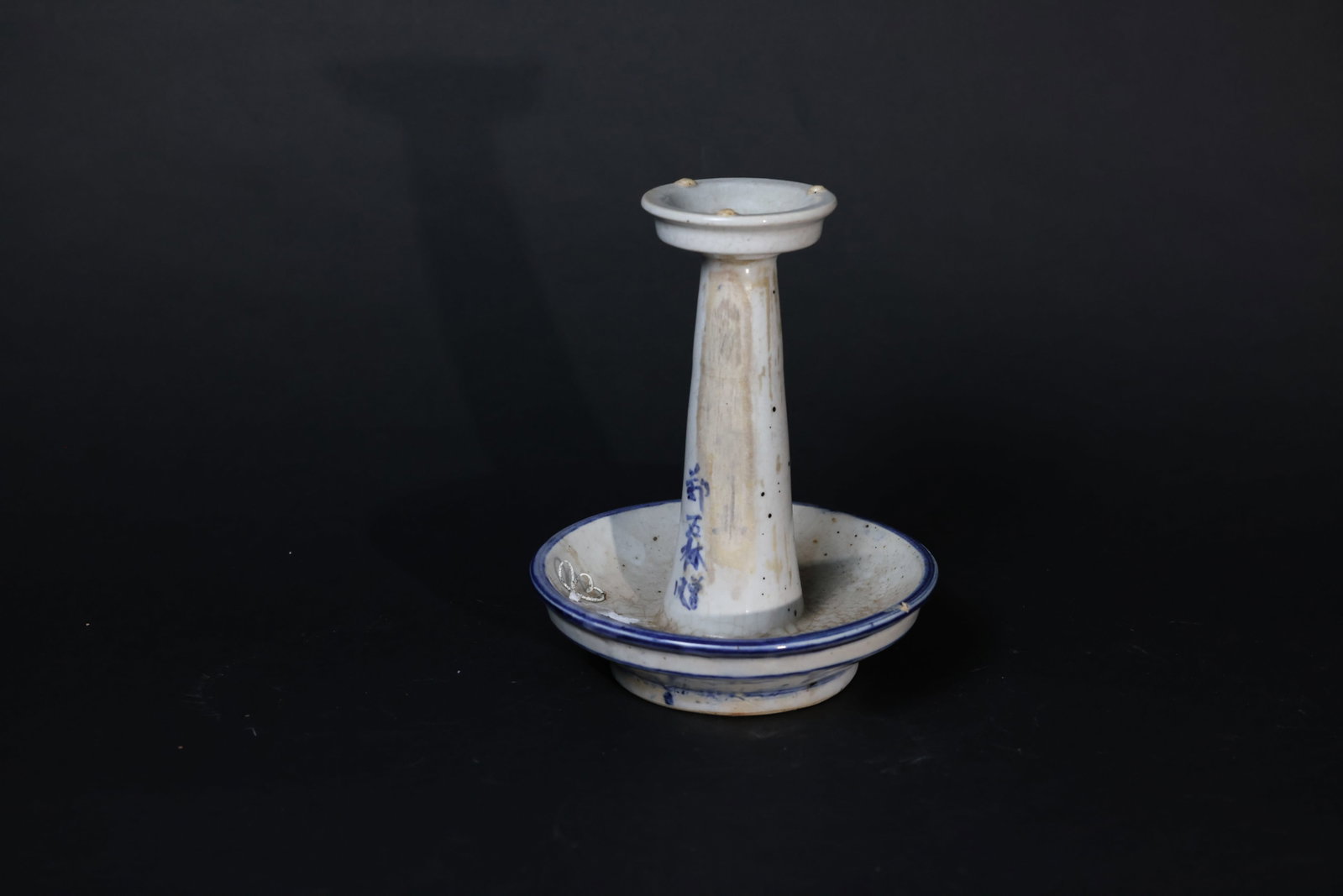 Chinese Blue-and-White Porcelain Votive Candlestick for Land God Shrine: Overall intact with no cracks or chips. The interior shows age-related crazing and heavy encrustation. Some localized glaze wear is present. No losses. Obvious signs of use consistent with age. H 23cm