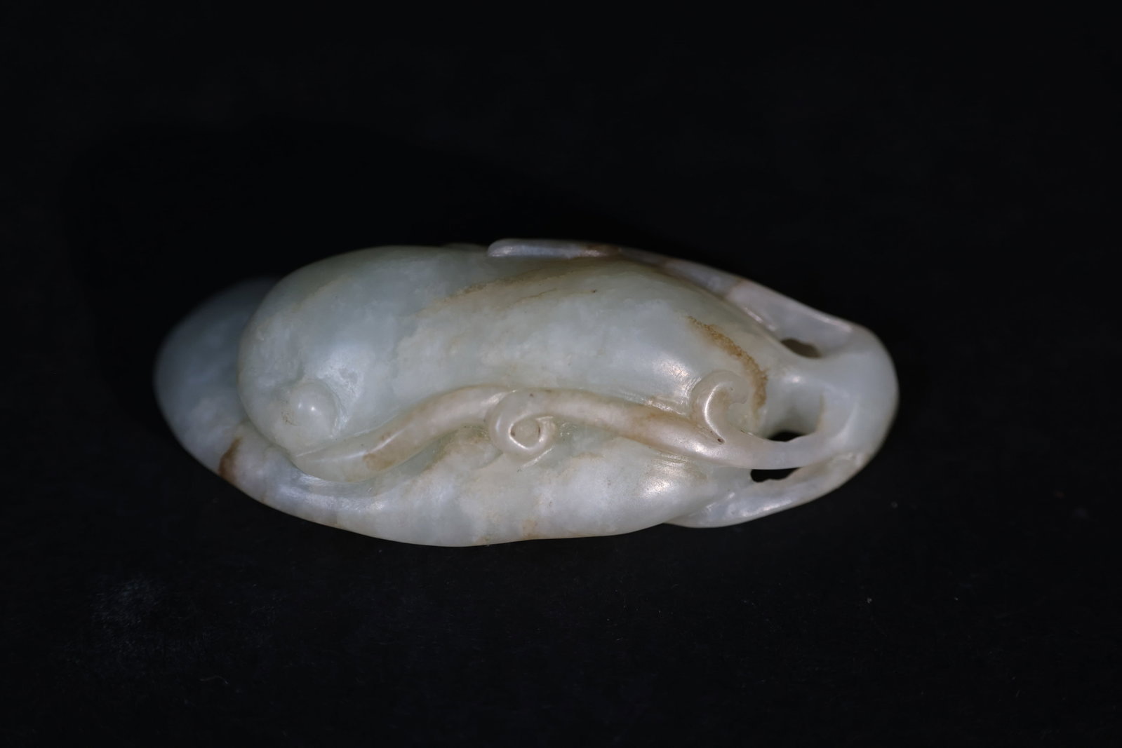 Qing Dynasty Hetian Jade "Golden Toad" Handpiece: Overall intact with no breaks or losses to the openwork carving. The surface displays natural "ox-hair" and russet inclusions, with an attractive aged patina. Some areas show natural crystalline