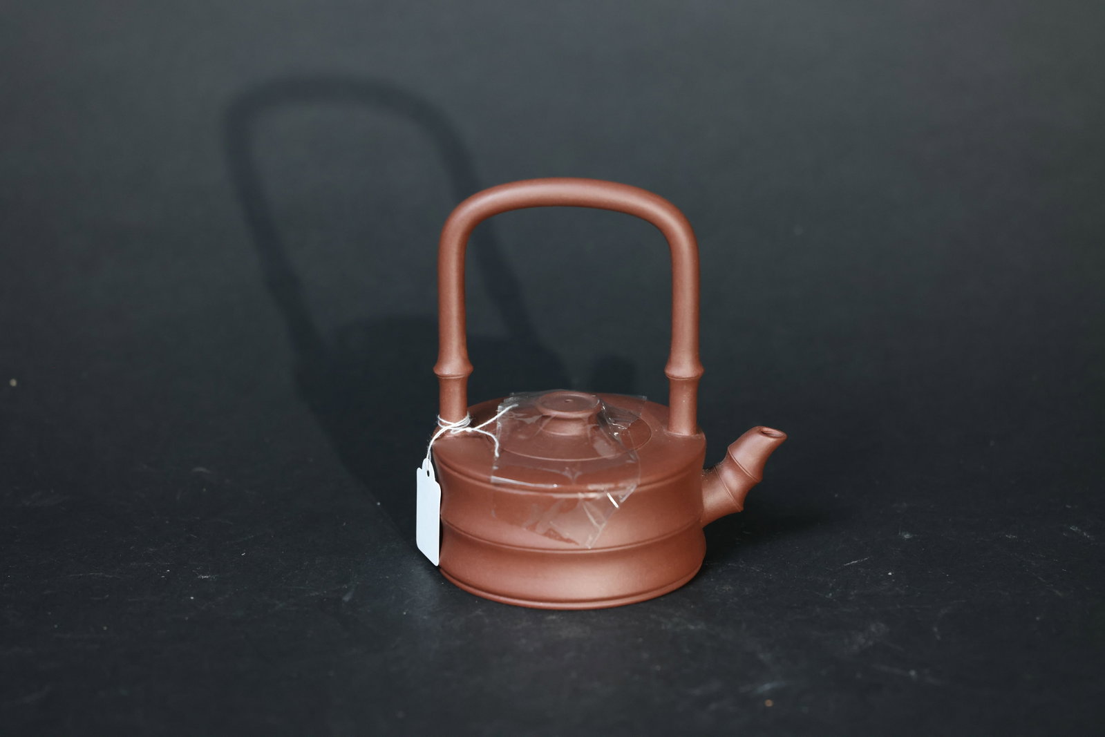 Flattened Bamboo-Form Bail-Handled Teapot by a Contemporary Master: Excellent condition, unused, with no chips, cracks, or repairs. H 13.5cm W 11cm