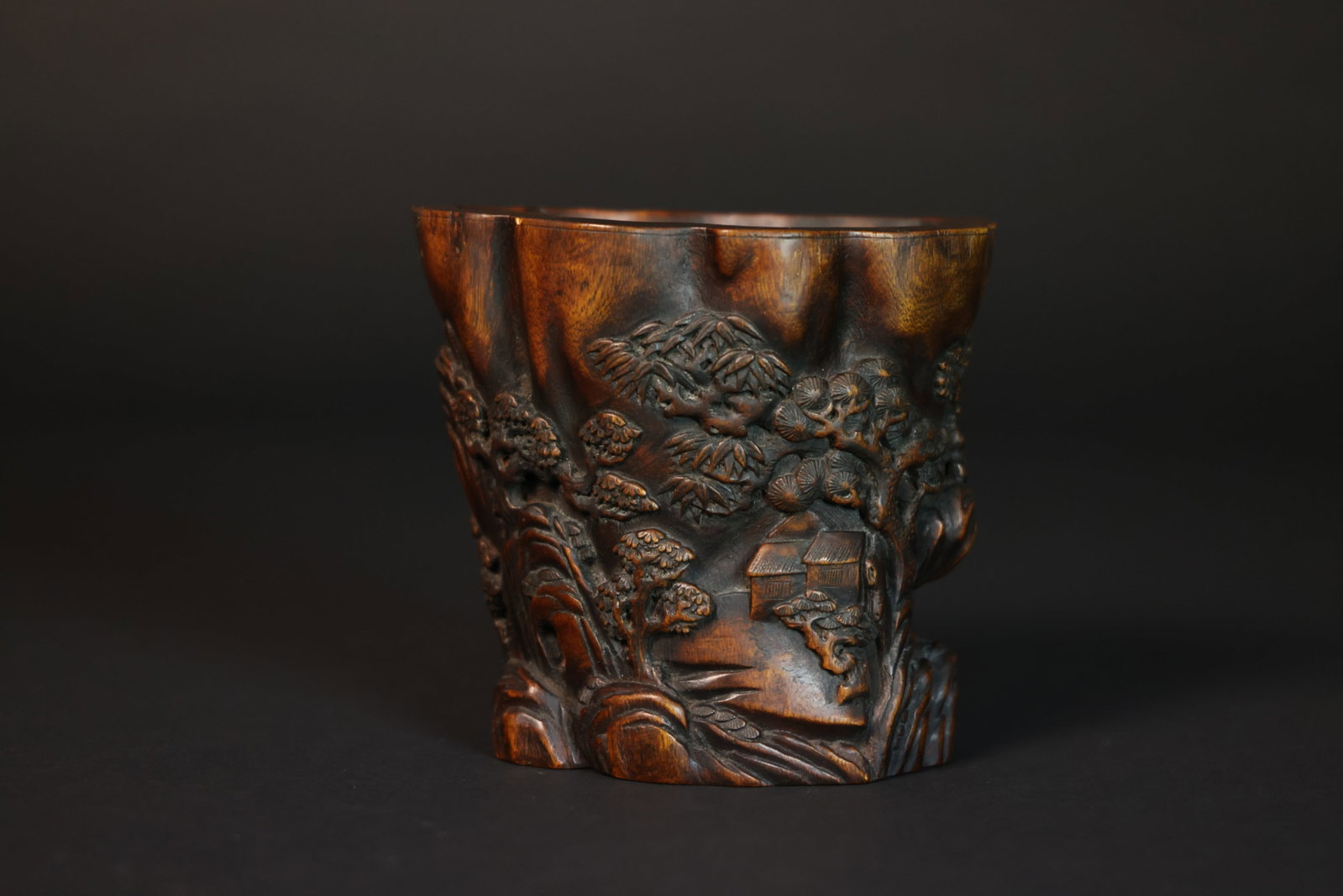 Carved Agarwood Brush Pot with Figures and Pine-and-House Motifs: Naturally patinated, otherwise in perfect condition H 15cm W 17cm